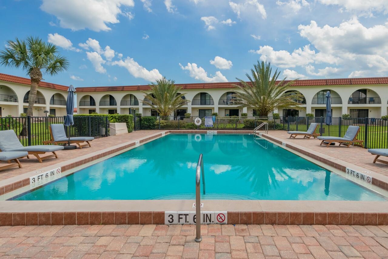 21 Dondanville Road, Unit 2 St. Augustine, FL 32080 - Photo 16 of 40 a view of a house with a swimming pool and porch with furniture