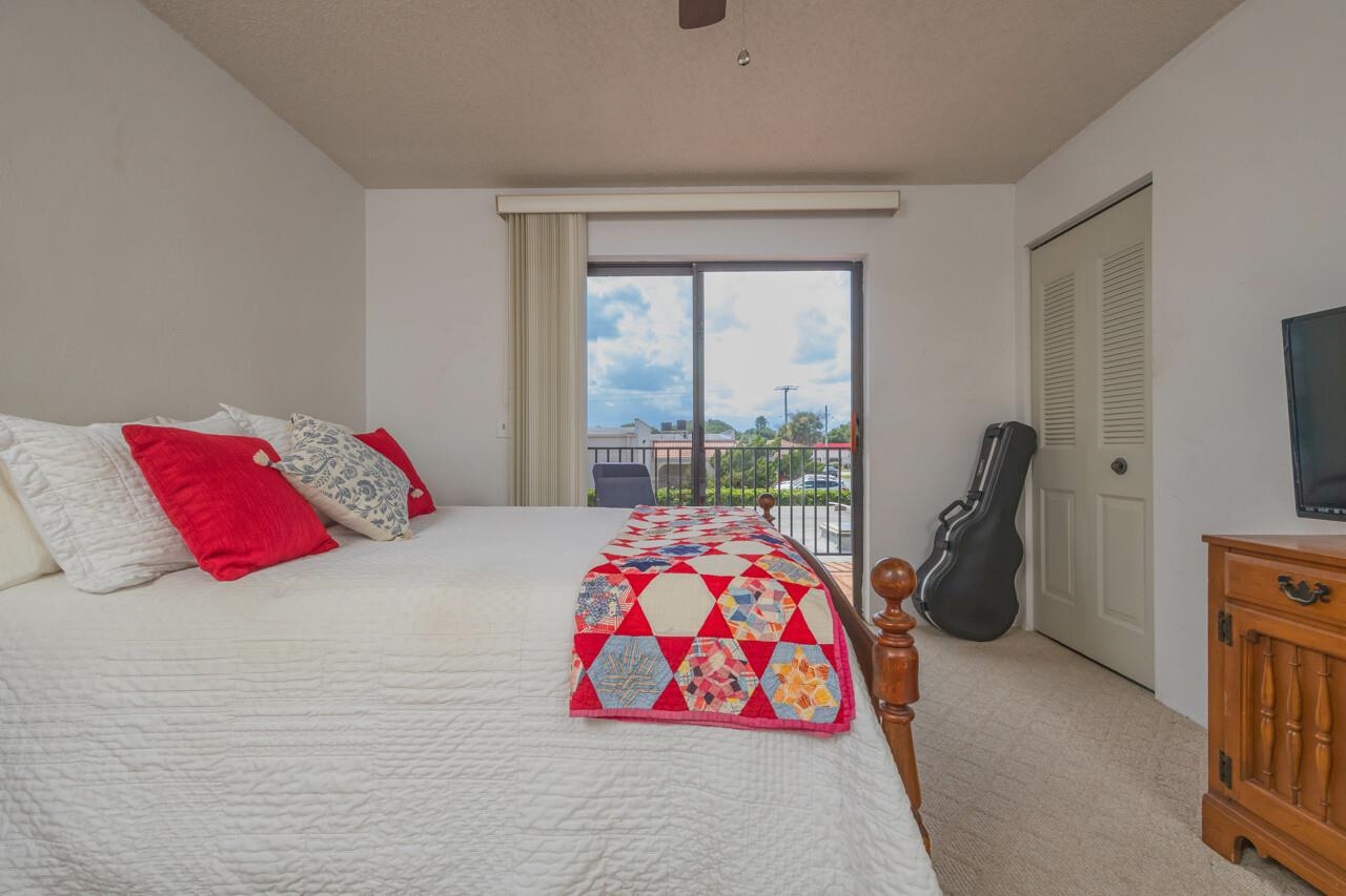 21 Dondanville Road, Unit 2 St. Augustine, FL 32080 - Photo 27 of 40 a bedroom with a bed and a window