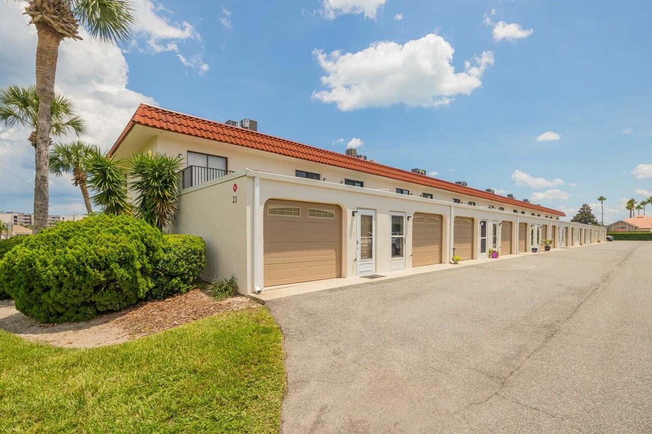 21 Dondanville Road, Unit 2 St. Augustine, FL 32080 - Photo 32 of 40 a front view of a house with a garden