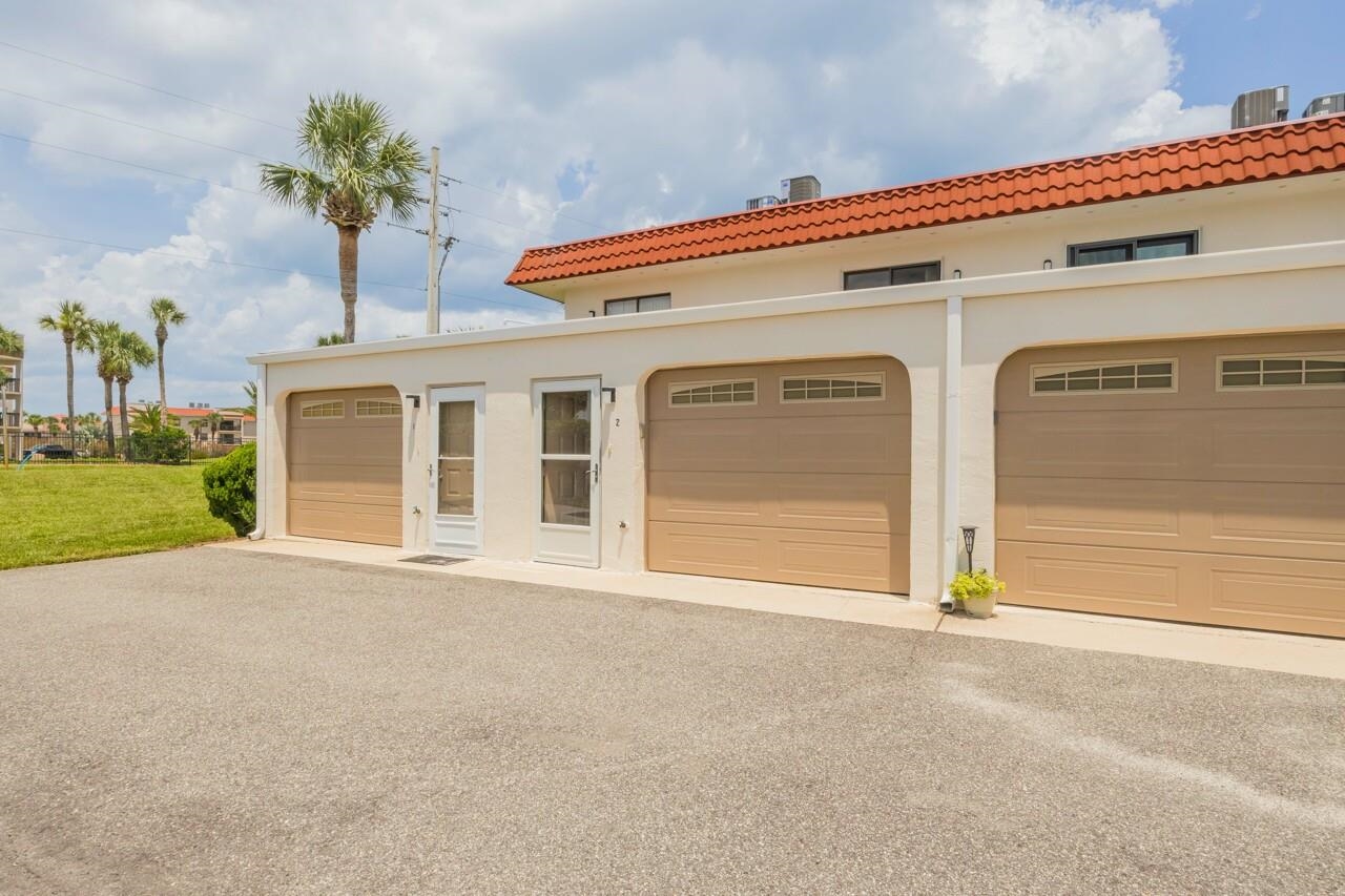 21 Dondanville Road, Unit 2 St. Augustine, FL 32080 - Photo 33 of 40 a front view of a house with a garage
