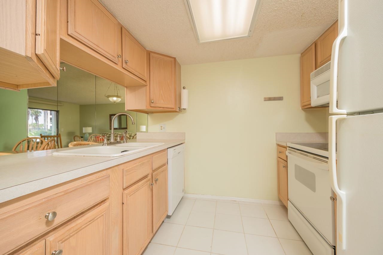 21 Dondanville Road, Unit 2 St. Augustine, FL 32080 - Photo 5 of 40 a kitchen with a sink and cabinets