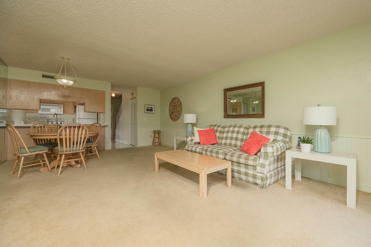 21 Dondanville Road, Unit 2 St. Augustine, FL 32080 - Photo 10 of 40 a living room with furniture and a table