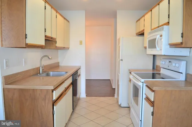 a utility room with a sink a washer and dryer