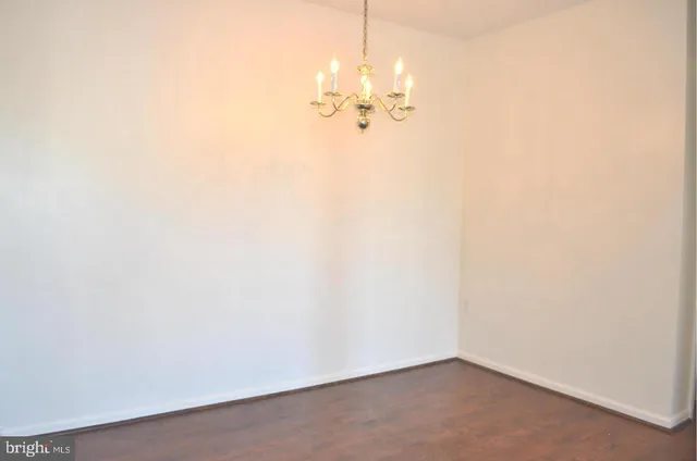 a view of a chandelier fan in a room