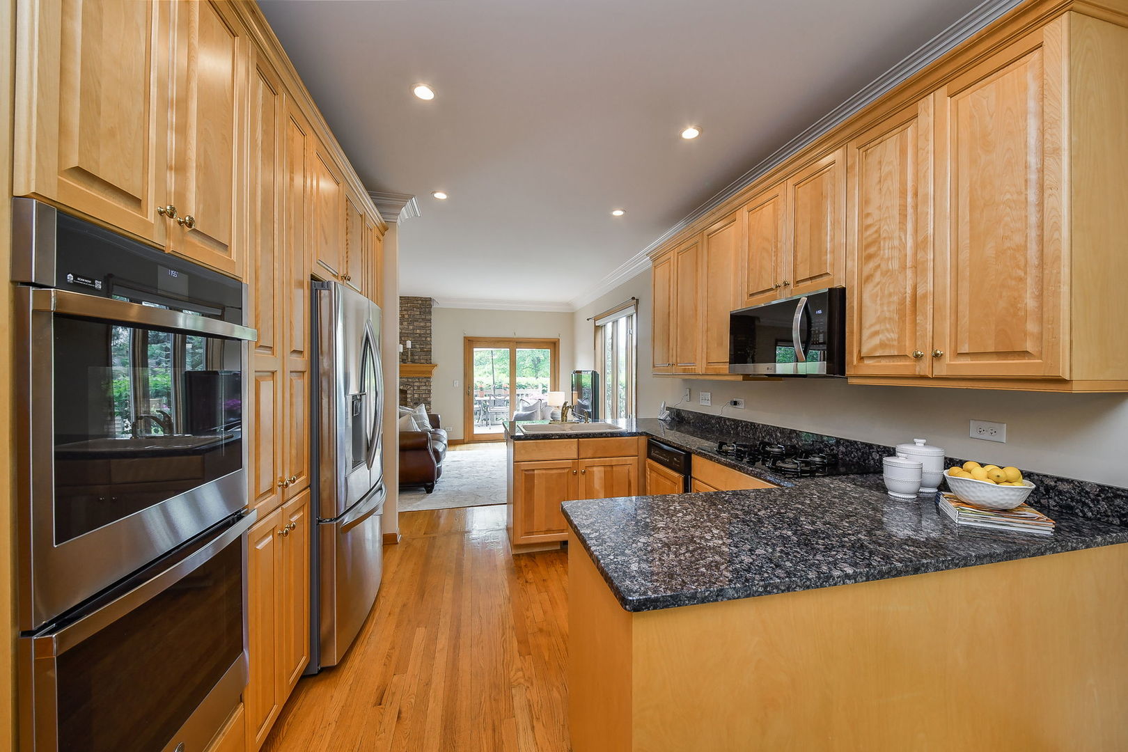 26W199 Klein Creek Drive Winfield, IL 60190 - Photo 11 of 29 a kitchen with stainless steel appliances granite countertop a refrigerator a stove top oven a sink and dishwasher