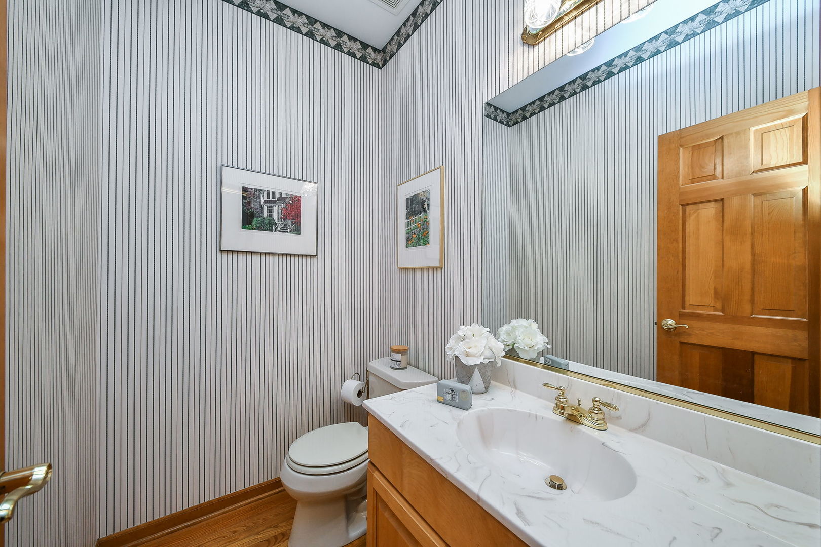 26W199 Klein Creek Drive Winfield, IL 60190 - Photo 13 of 29 a bathroom with a toilet sink and mirror