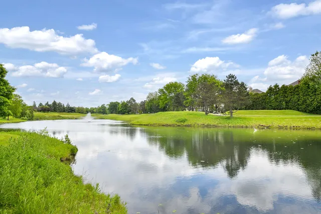 a view of a lake with a big yard