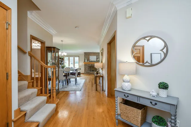 a living room with furniture and a mirror