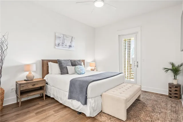 a bedroom with a bed and a potted plant