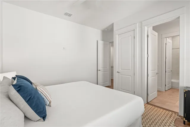 a bedroom with a bed and a walk in closet