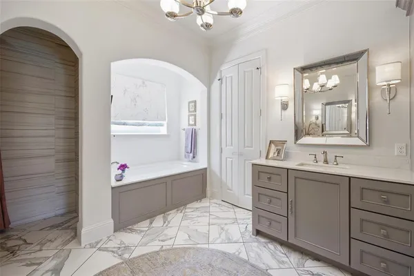 a bathroom with a sink a mirror and a shower