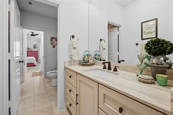 a bathroom with double vanity sinks a vanity and a mirror