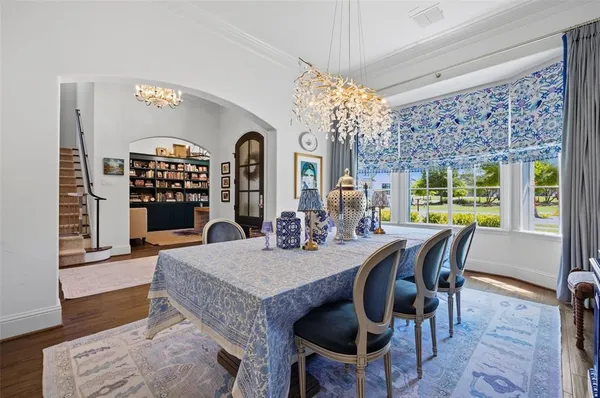a living room with furniture cabinets and window