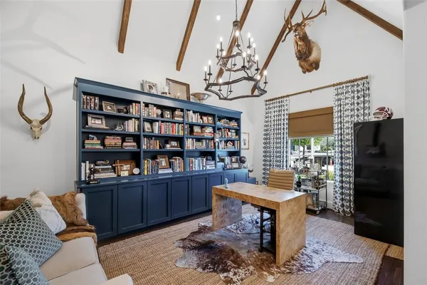 a living room with furniture fireplace and flat screen tv