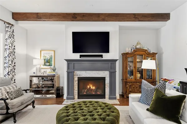 a view of living room with furniture fireplace and flat screen tv