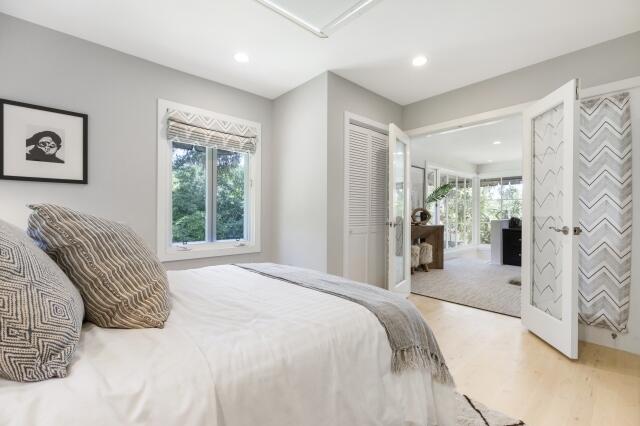 780 Mission Canyon Road Santa Barbara, CA 93105 - Photo 55 of 97 a bedroom with a balcony a bed and a large mirror