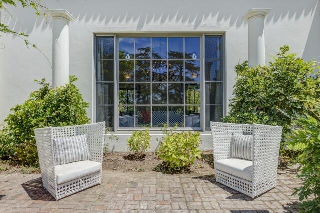 780 Mission Canyon Road Santa Barbara, CA 93105 - Photo 73 of 97 a view of a chair and tables in the back yard of the house