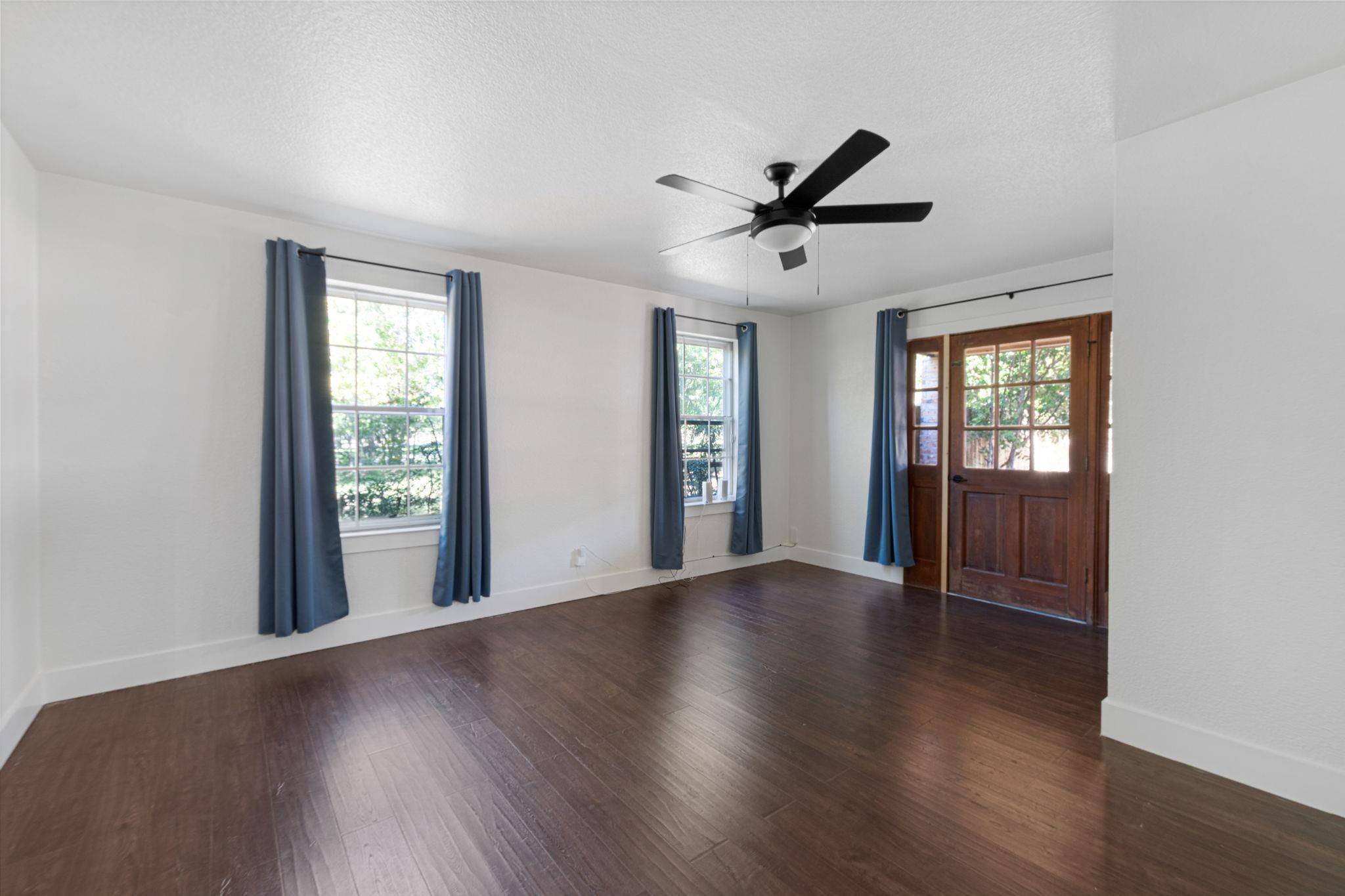 1307 Nix Road Lampasas, TX 76550 - Photo 14 of 30 a view of an empty room with wooden floor and a window