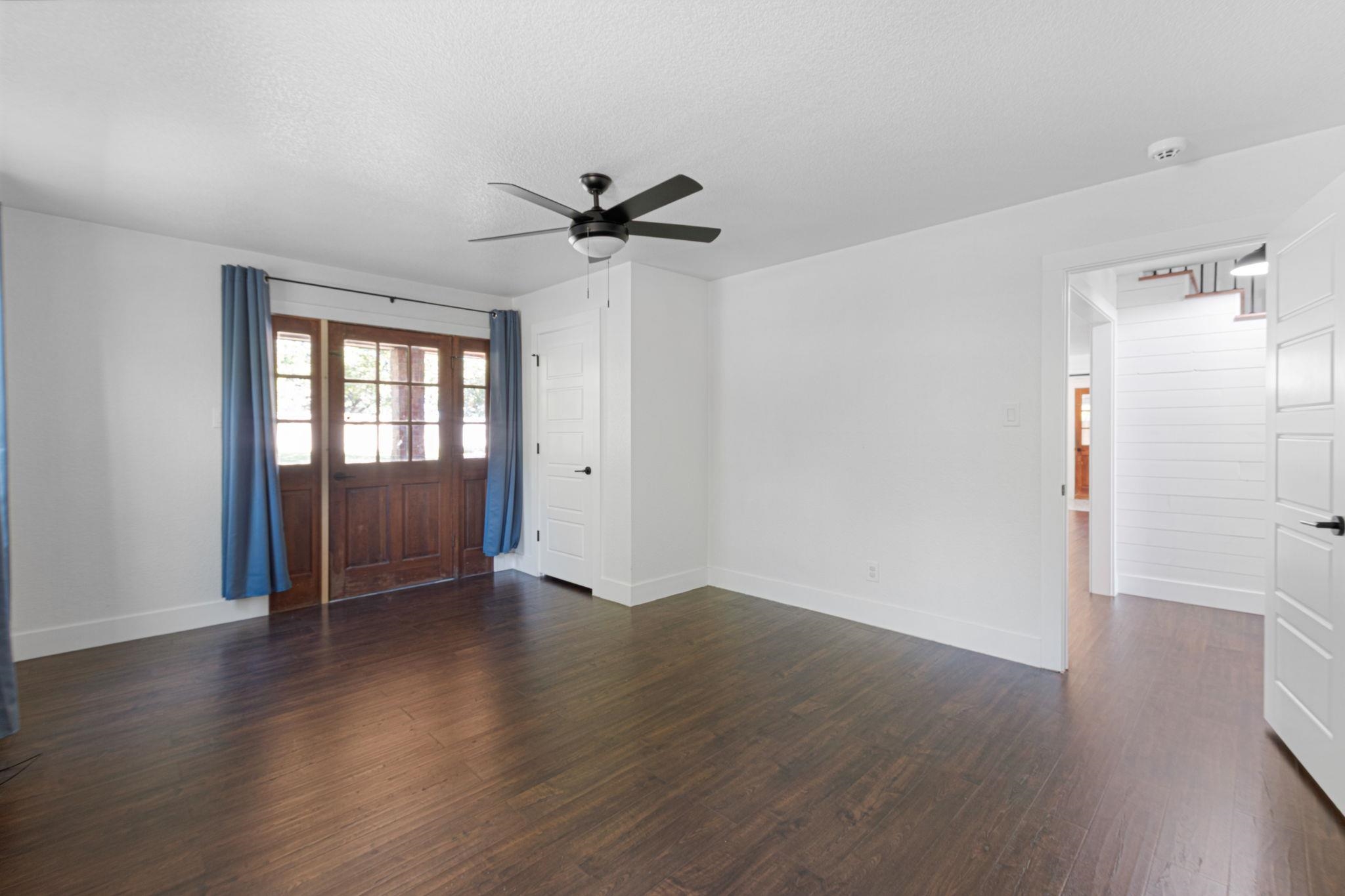 1307 Nix Road Lampasas, TX 76550 - Photo 15 of 30 an empty room with wooden floor cabinet and windows