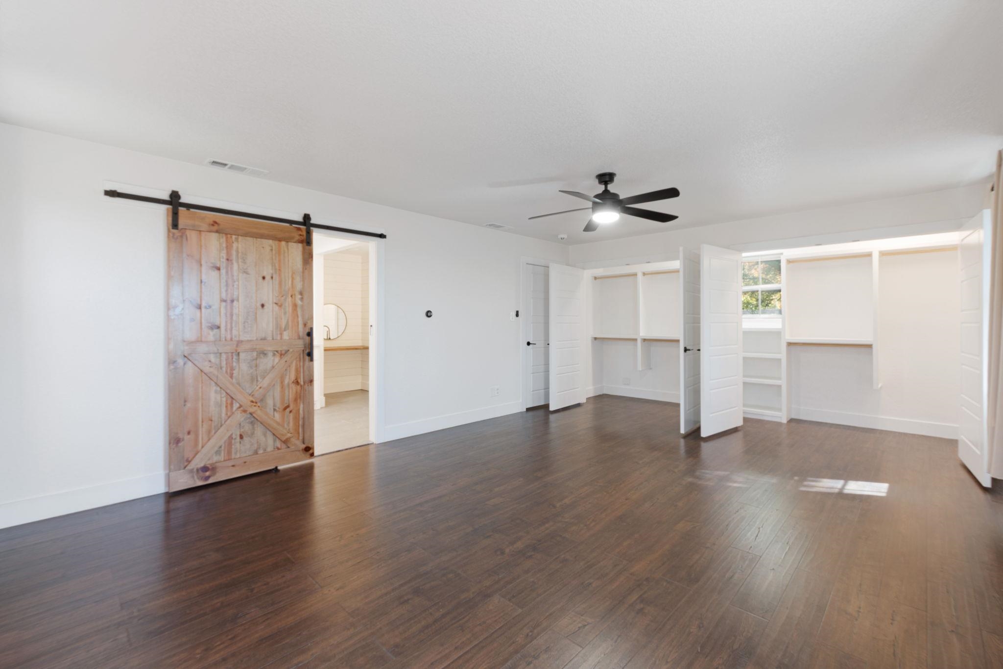 1307 Nix Road Lampasas, TX 76550 - Photo 21 of 30 an empty room with wooden floor and a ceiling fan