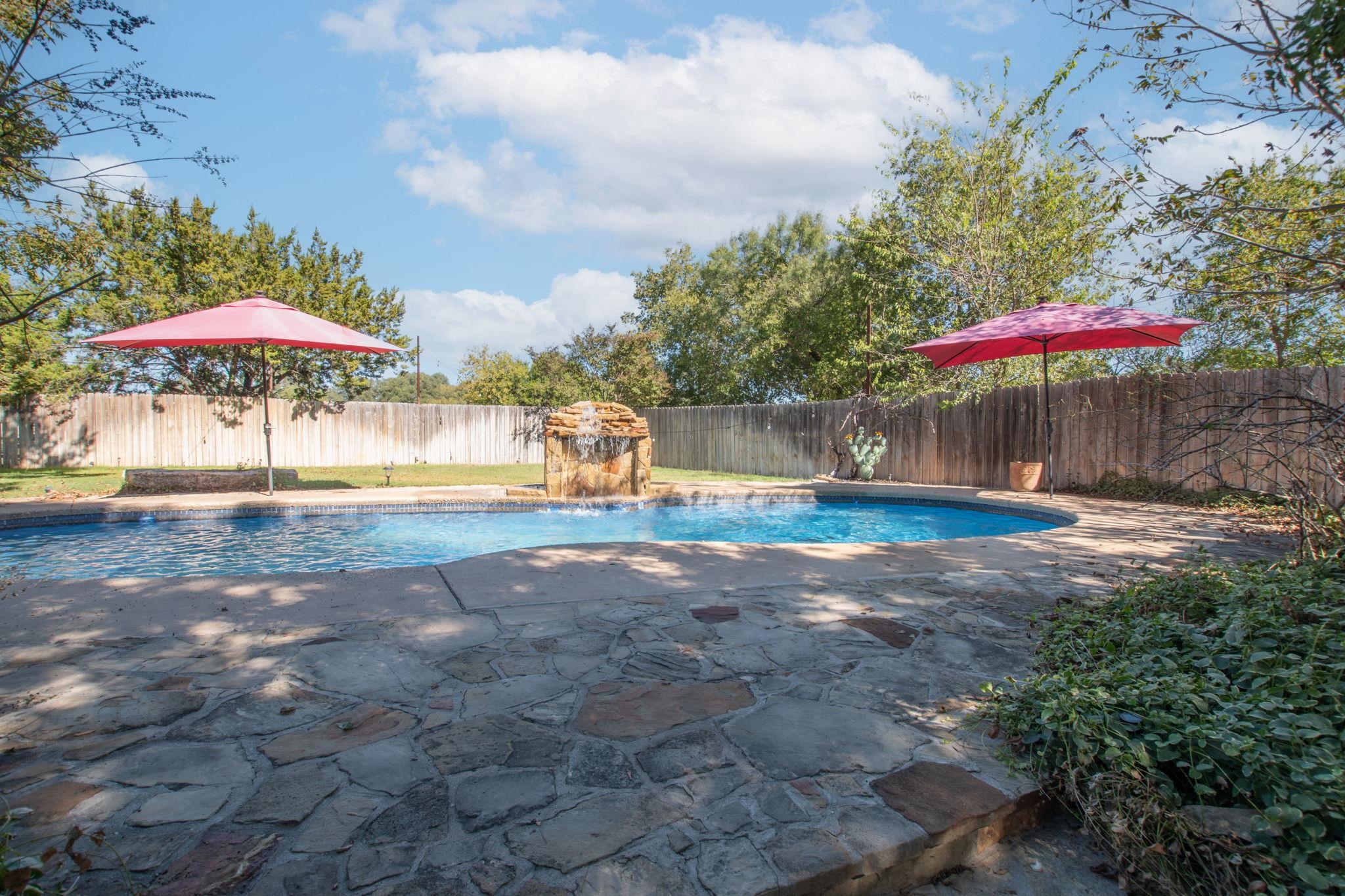 1307 Nix Road Lampasas, TX 76550 - Photo 28 of 30 a view of a water with a table under an umbrella
