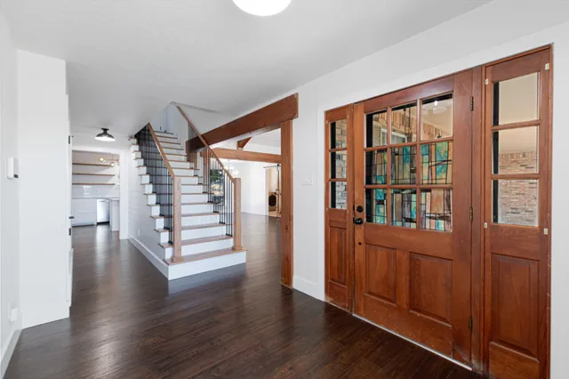 wooden floor in an empty room with a window and wooden floor