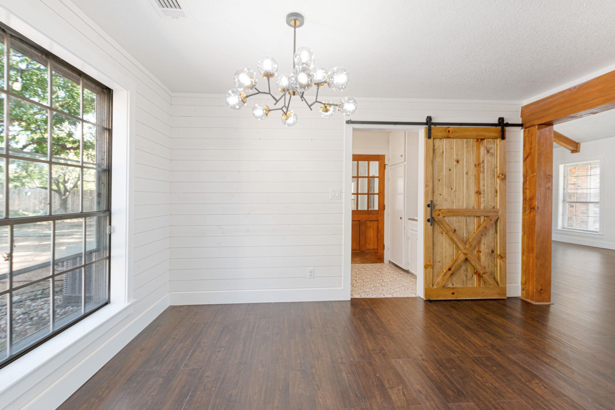 1307 Nix Road Lampasas, TX 76550 - Photo 9 of 30 a view of an empty room with wooden floor and a window