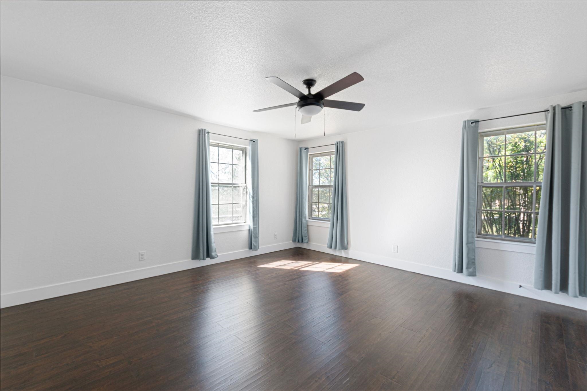 1307 Nix Road Lampasas, TX 76550 - Photo 10 of 30 a view of a big room with wooden floor and windows