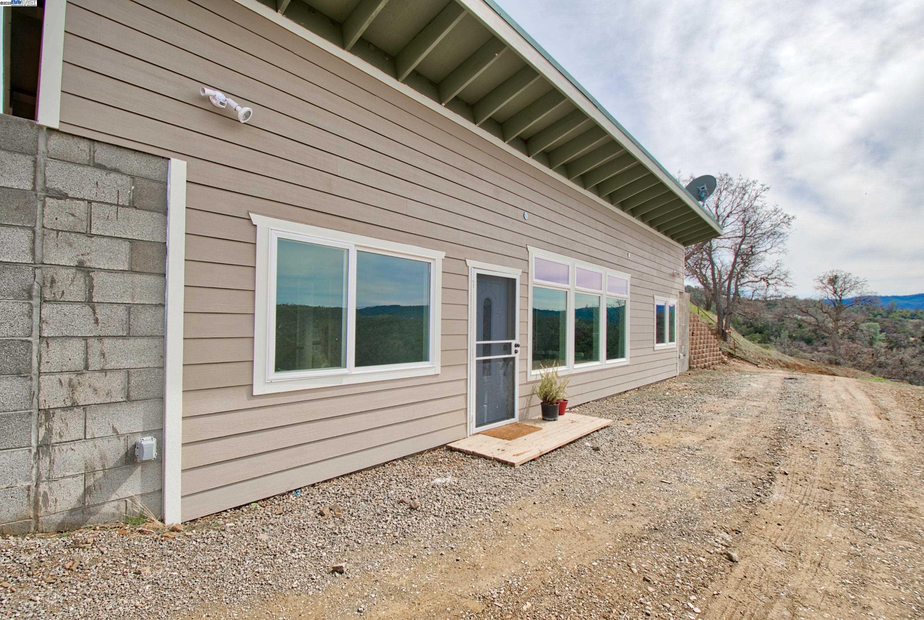 19990 Mines Road Livermore, CA 94550 - Photo 2 of 18 a view of a house with a backyard