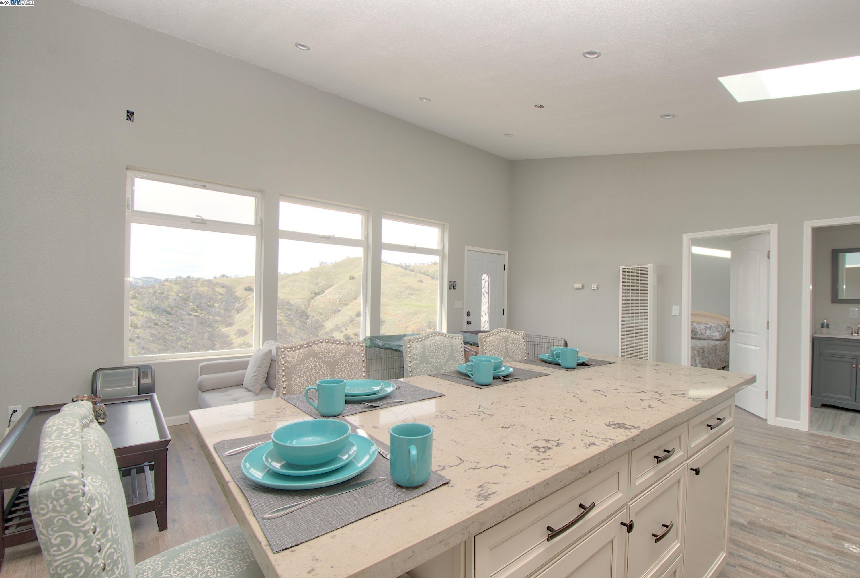 19990 Mines Road Livermore, CA 94550 - Photo 9 of 18 a living room with granite countertop furniture and a large window