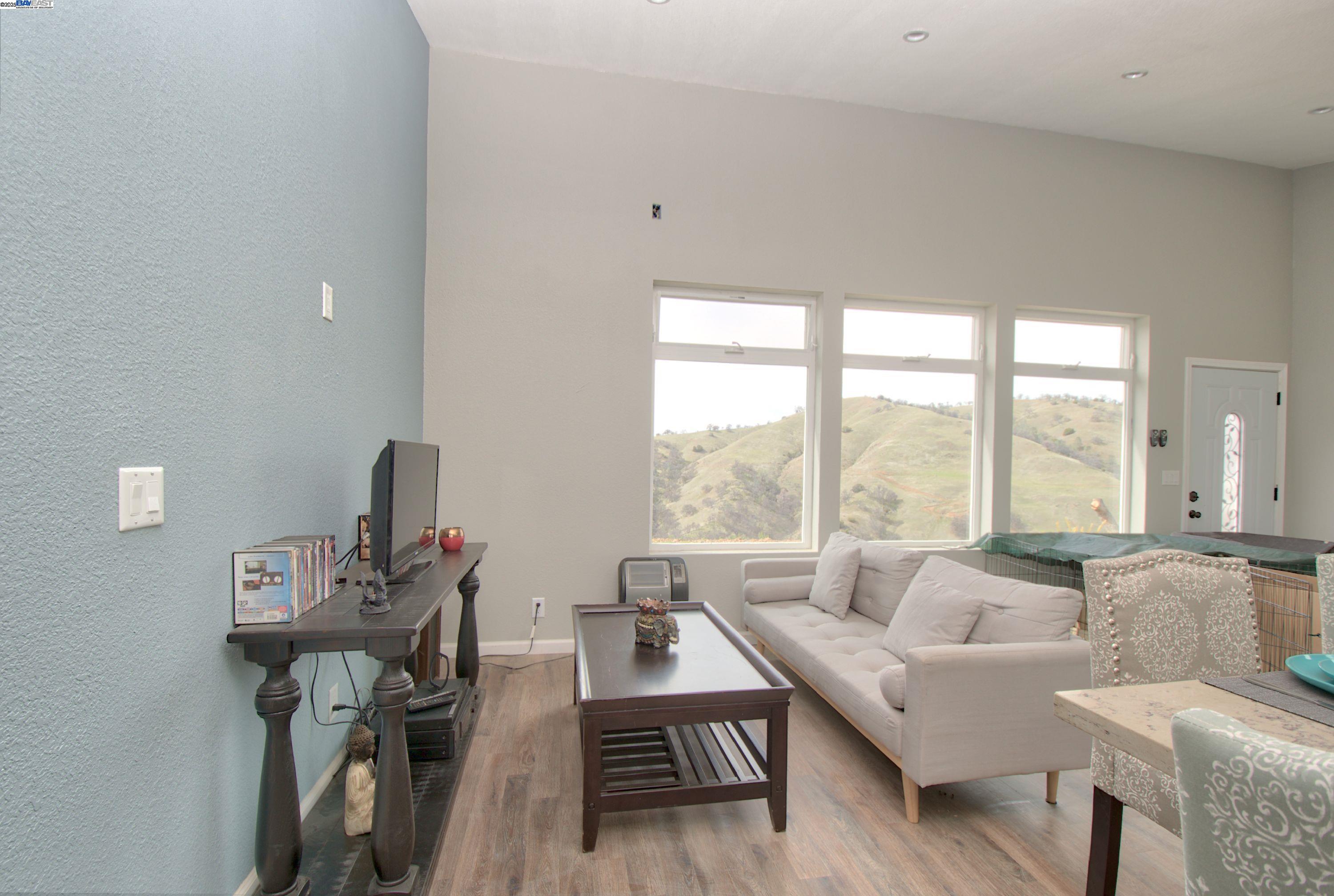 19990 Mines Road Livermore, CA 94550 - Photo 10 of 18 a living room with furniture and a large window