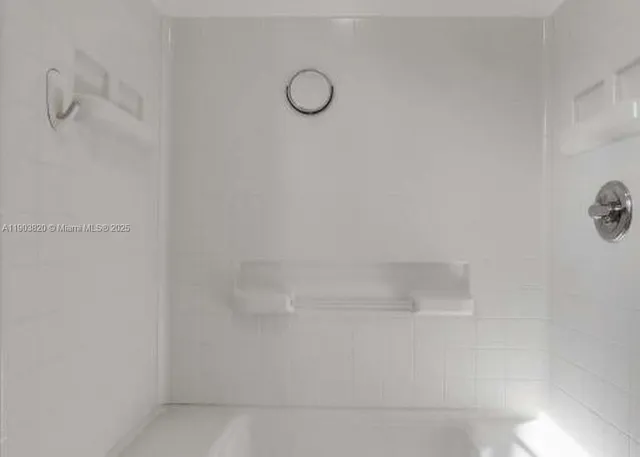 a bathroom with a sink a toilet and shower curtain