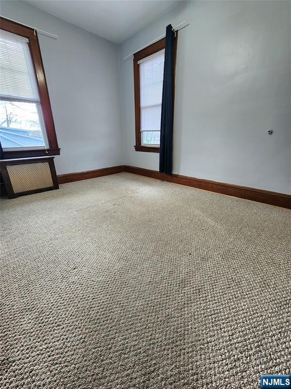 220 9th Avenue, Unit 2 Hawthorne, NJ 07506 - Photo 4 of 8 a view of an empty room with a window