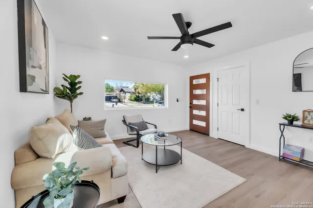 a living room with furniture and window