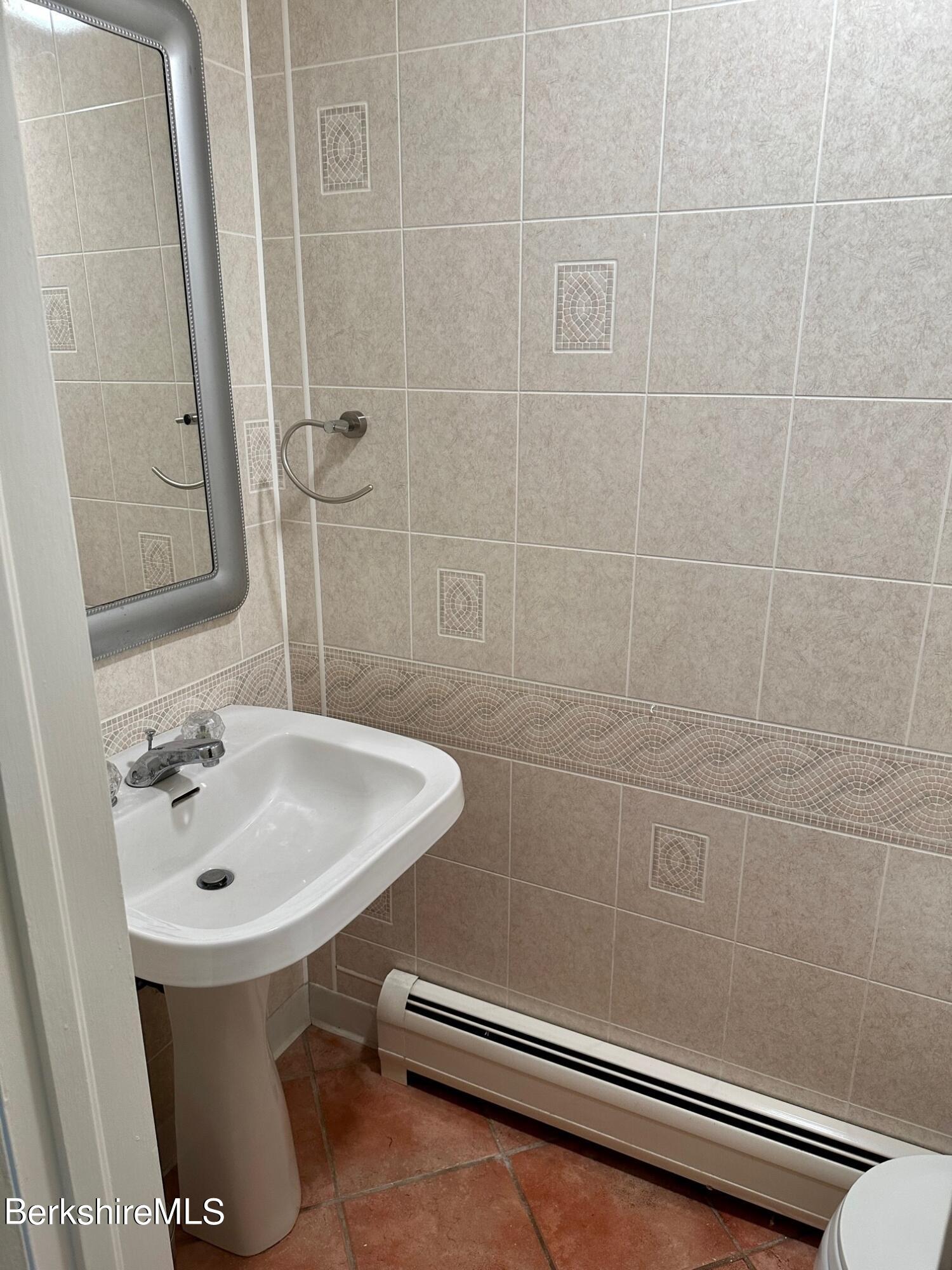 5 Cherry Hill Road Stockbridge, MA 01262 - Photo 12 of 39 a bathroom with a sink a toilet and shower