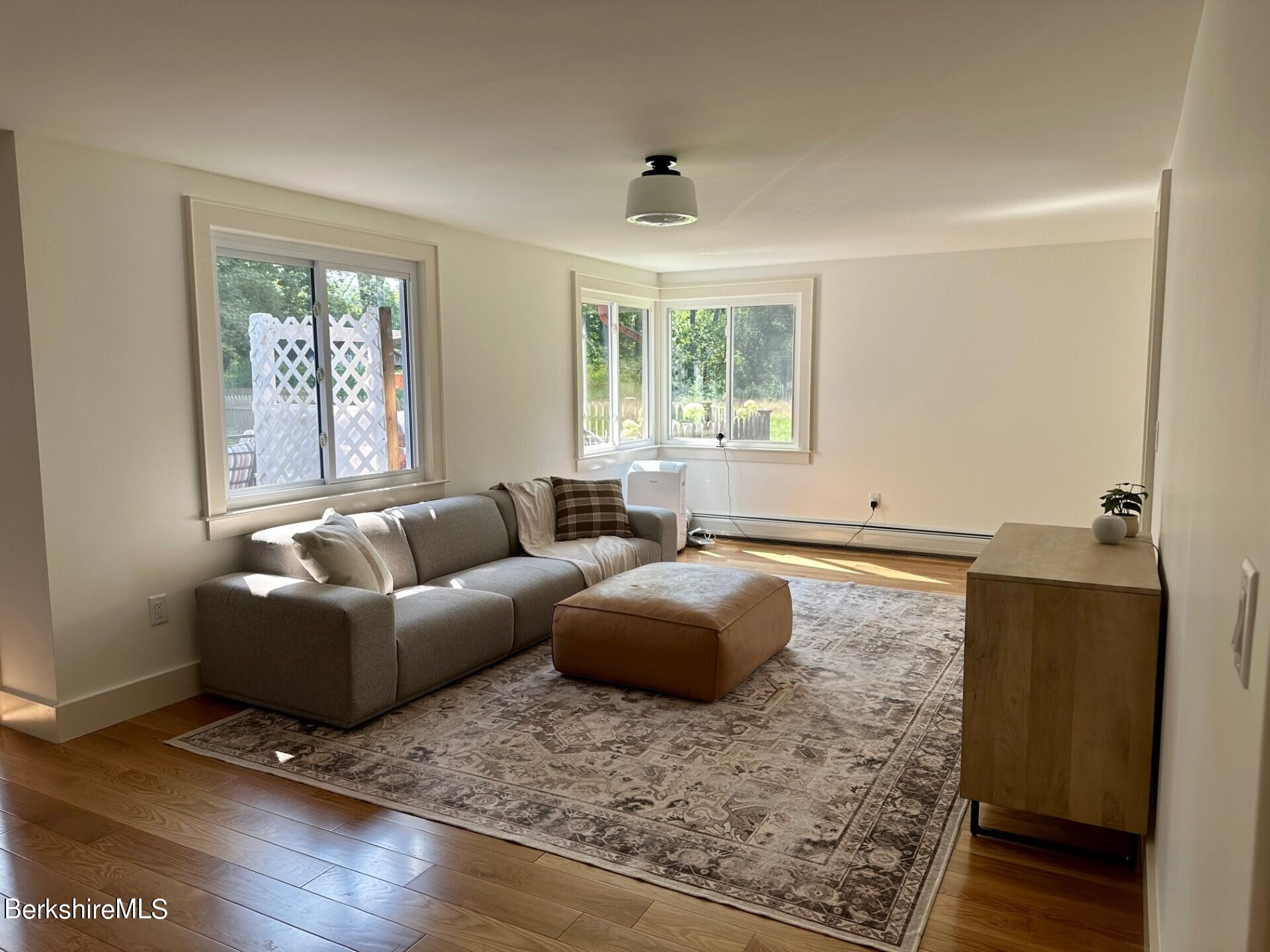 5 Cherry Hill Road Stockbridge, MA 01262 - Photo 13 of 39 a living room with furniture window and wooden floor