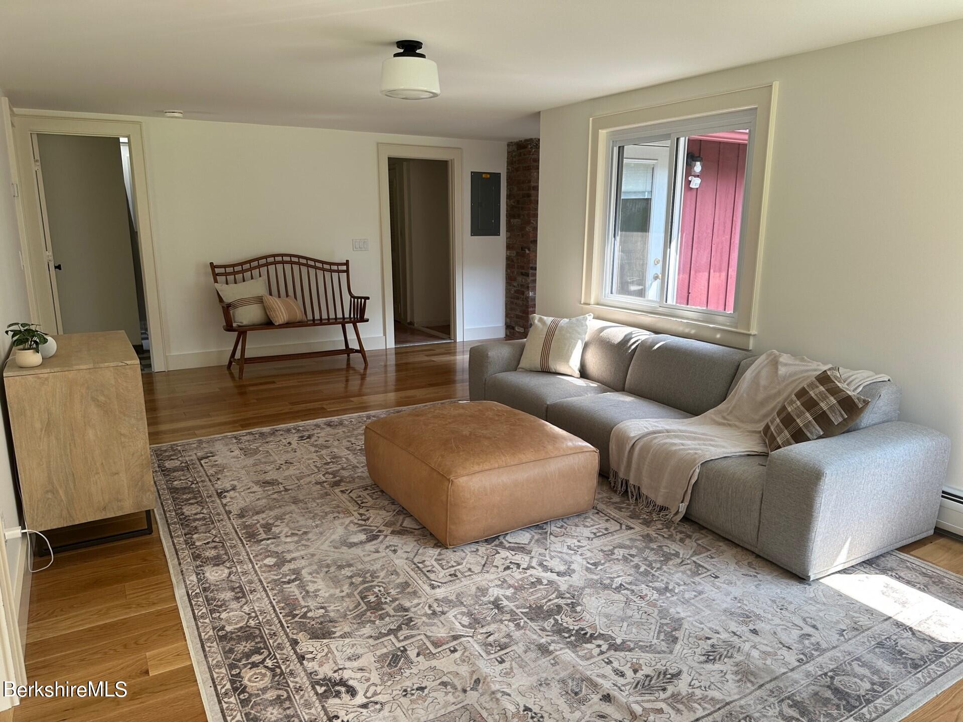 5 Cherry Hill Road Stockbridge, MA 01262 - Photo 14 of 39 a living room with furniture and wooden floor