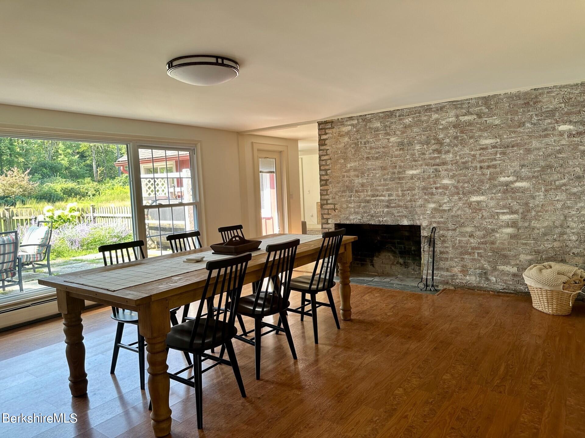 5 Cherry Hill Road Stockbridge, MA 01262 - Photo 22 of 39 a dining room with furniture and wooden floor