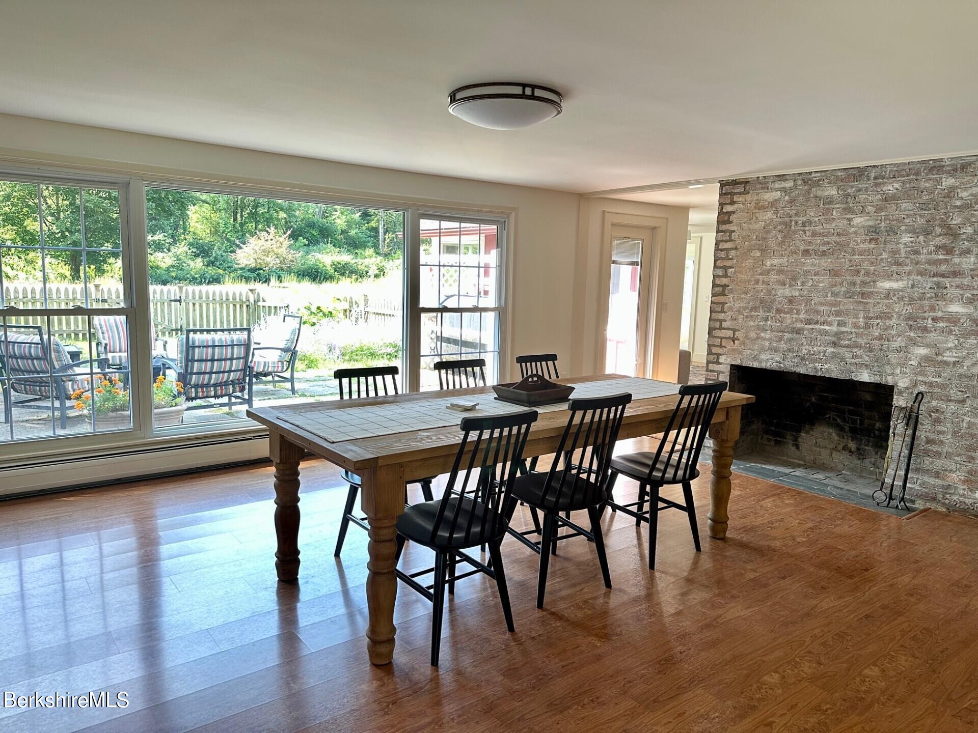5 Cherry Hill Road Stockbridge, MA 01262 - Photo 24 of 39 a dining room with furniture and wooden floor