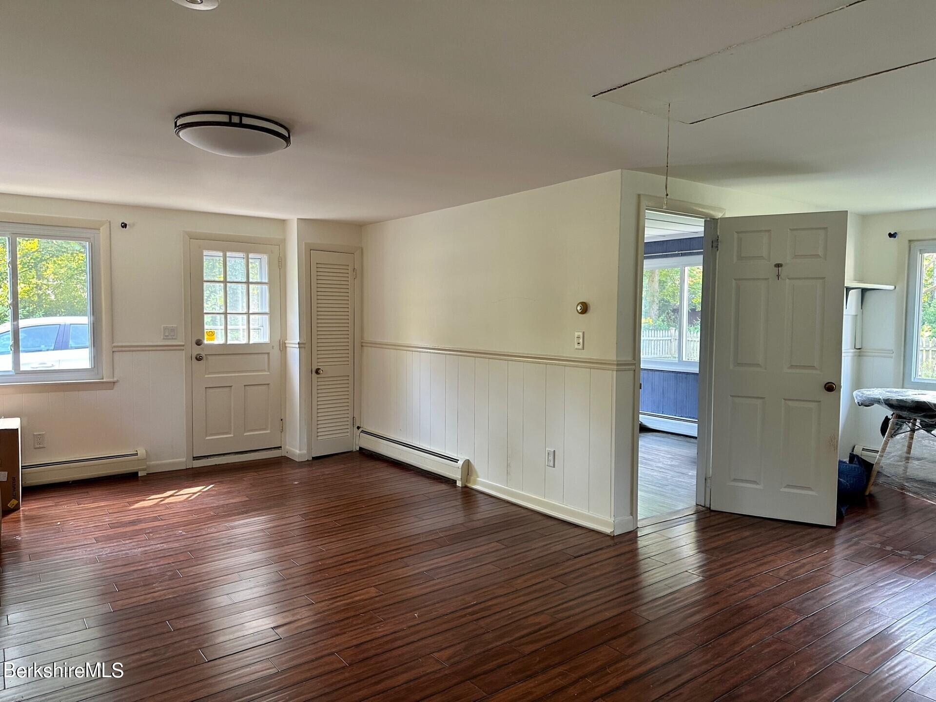 5 Cherry Hill Road Stockbridge, MA 01262 - Photo 27 of 39 an empty room with wooden floor and windows