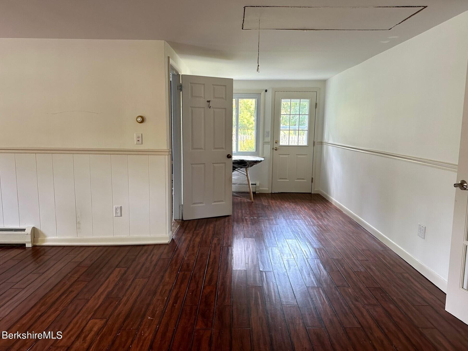 5 Cherry Hill Road Stockbridge, MA 01262 - Photo 28 of 39 an empty room with wooden floor and windows