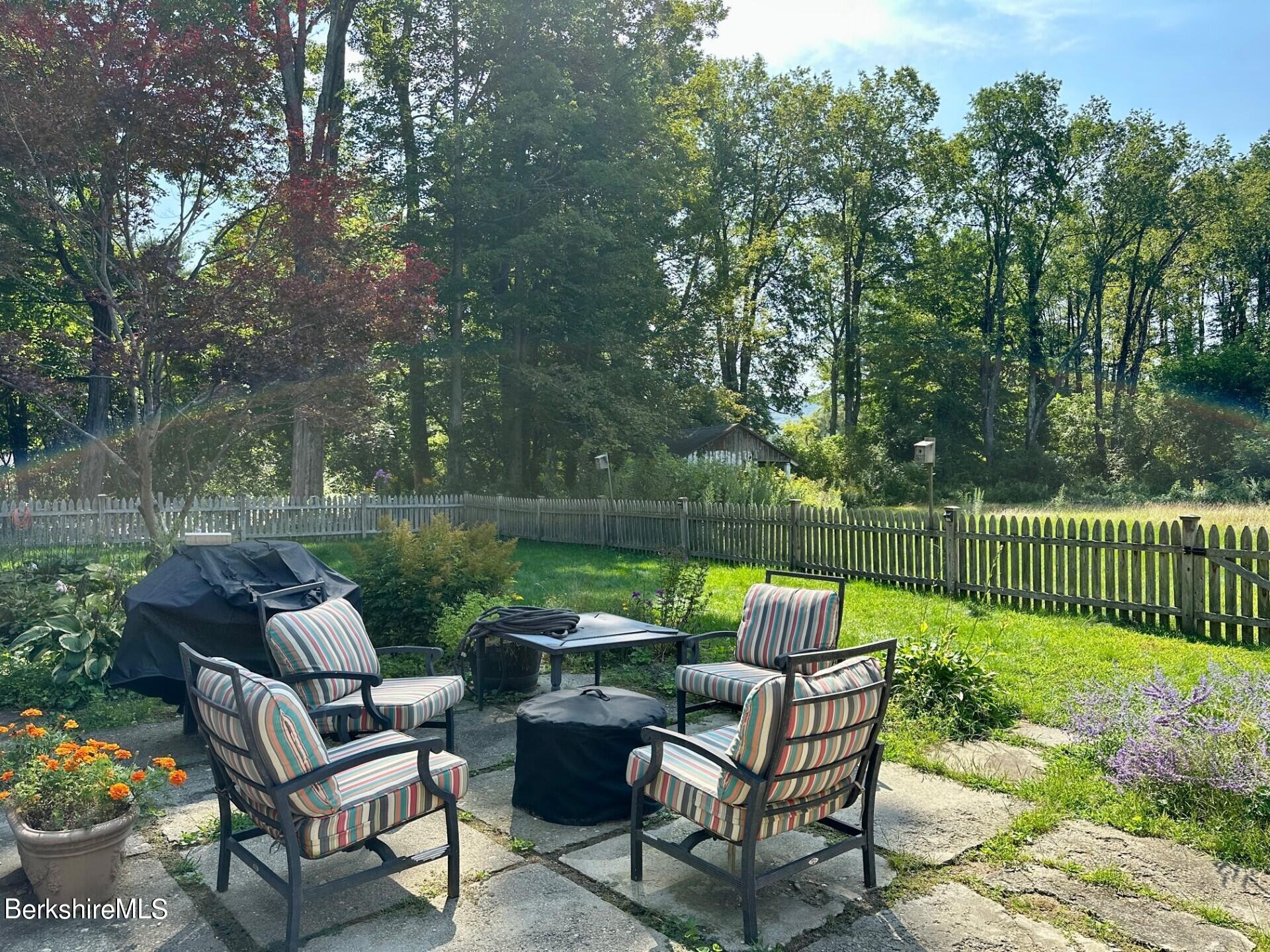 5 Cherry Hill Road Stockbridge, MA 01262 - Photo 29 of 39 a view of a table and chairs on the deck