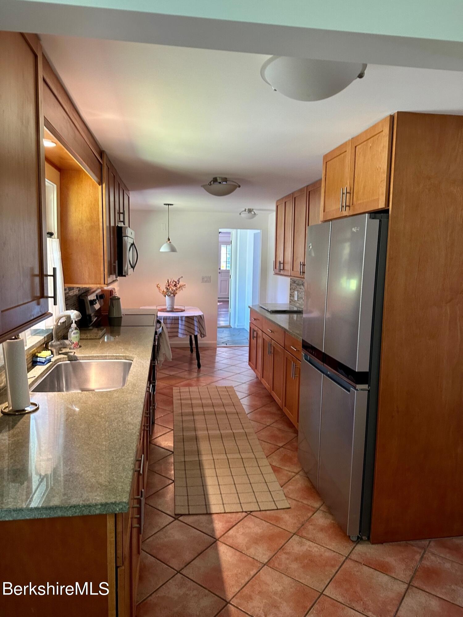 5 Cherry Hill Road Stockbridge, MA 01262 - Photo 7 of 39 a kitchen with stainless steel appliances granite countertop a refrigerator a stove and a sink dishwasher
