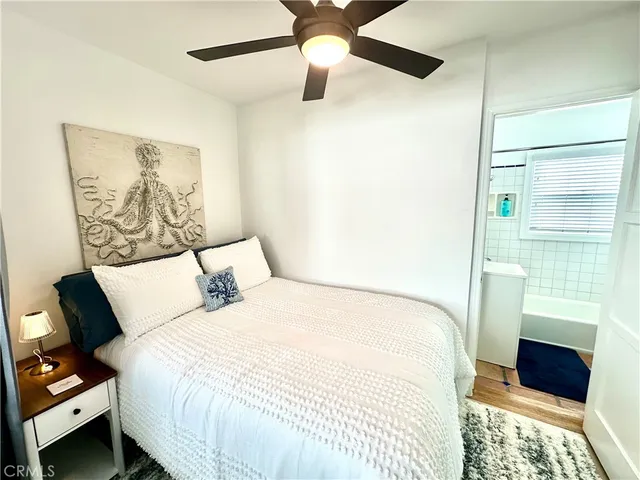 a bedroom with a bed and a walk in closet