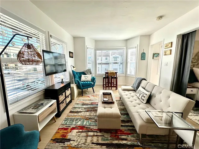 a living room with furniture fireplace and a flat screen tv