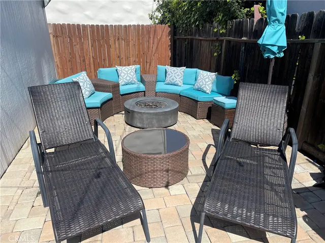 a view of a chairs and table in the patio
