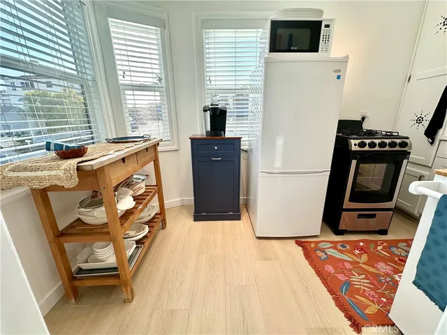 a room with wooden floor and a flat screen tv