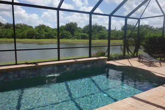 a view of swimming pool with a patio