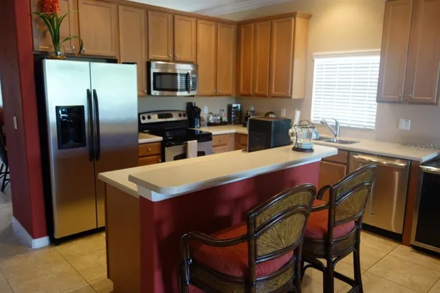 a kitchen with a refrigerator a stove a sink and dishwasher