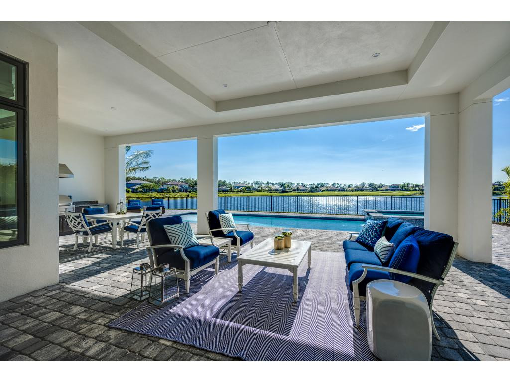 9828 Montiano Place Naples, FL 34113 - Photo 11 of 18 a view of a living room and dining room